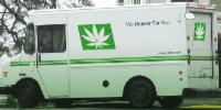 A delivery truck with a weed symbol on it
